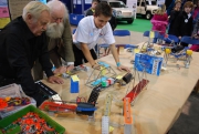 Trevor Baylis and Michael Denny looking at meccano models made by children
